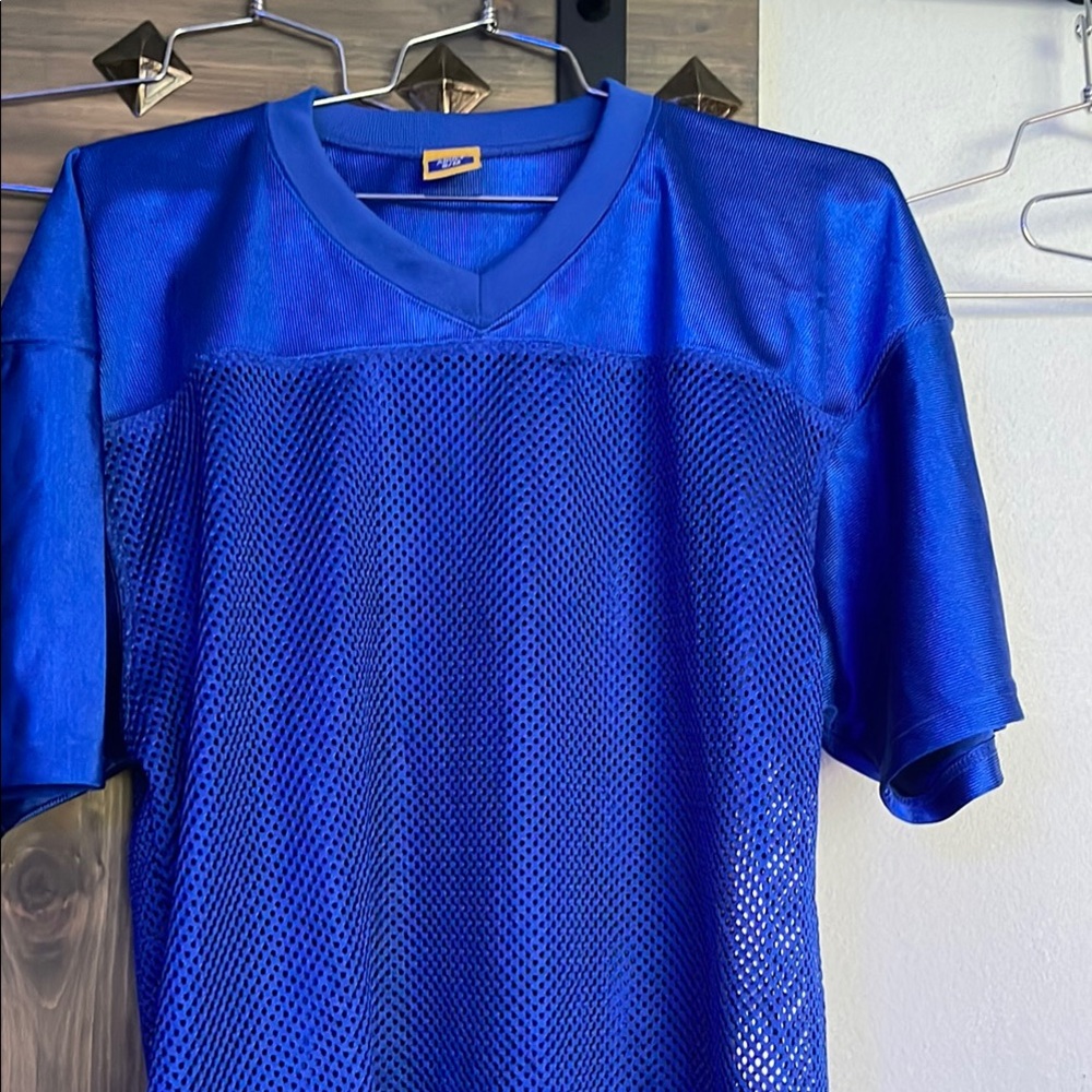 Blue Mesh football jersey waist length. New